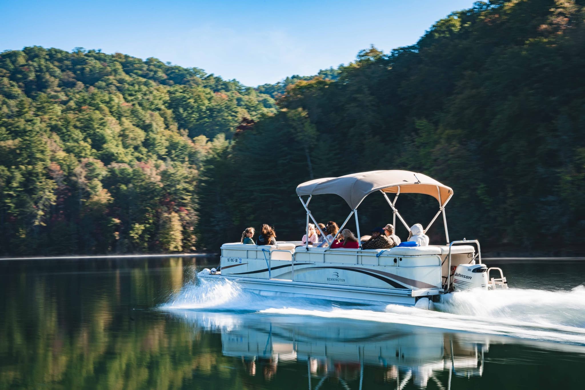 Pontoon boat cruising on Lake Jocassee